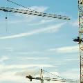 Three tower cranes with limit switch parts attached