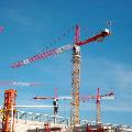 Three tower cranes with wire rope cable parts attached