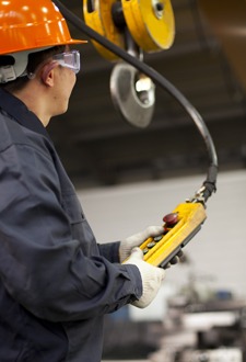 Operator controlling a crane for training purposes