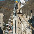 Butti attachments parts man using bucket to pour concrete