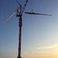 Kroll turbine crane with parts working during sunset