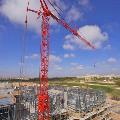 Potain crane and attachment parts working in a construction site