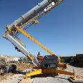 Potain self erecting crane with parts on construction site