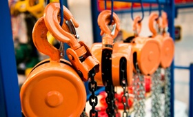 Crane hooks and attachment parts hanging on display