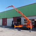 Jekko mini crawler crane rental extended in from of shop