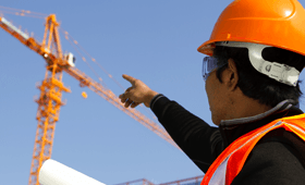 Worker pointing at a crane rental