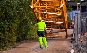 Tech servicing crane on site