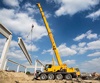 Mobile crane lifting beam while training